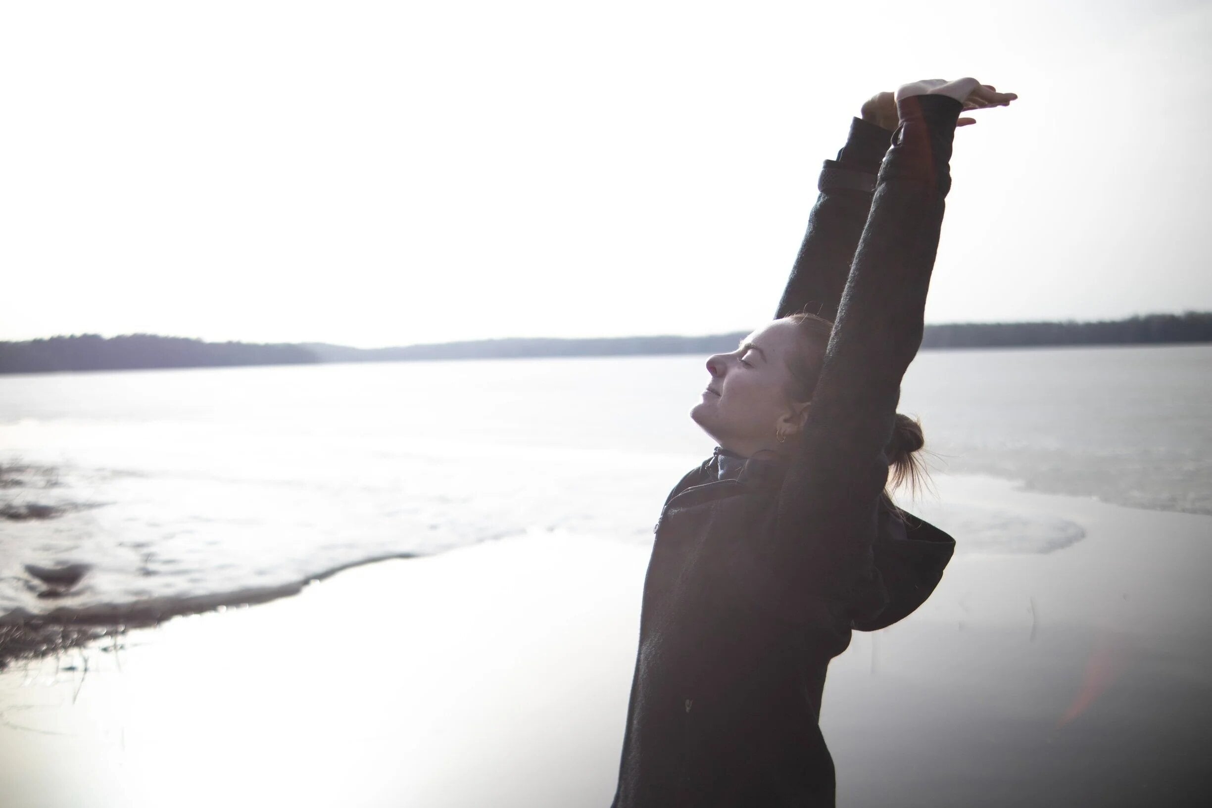 Zael stretching by the water