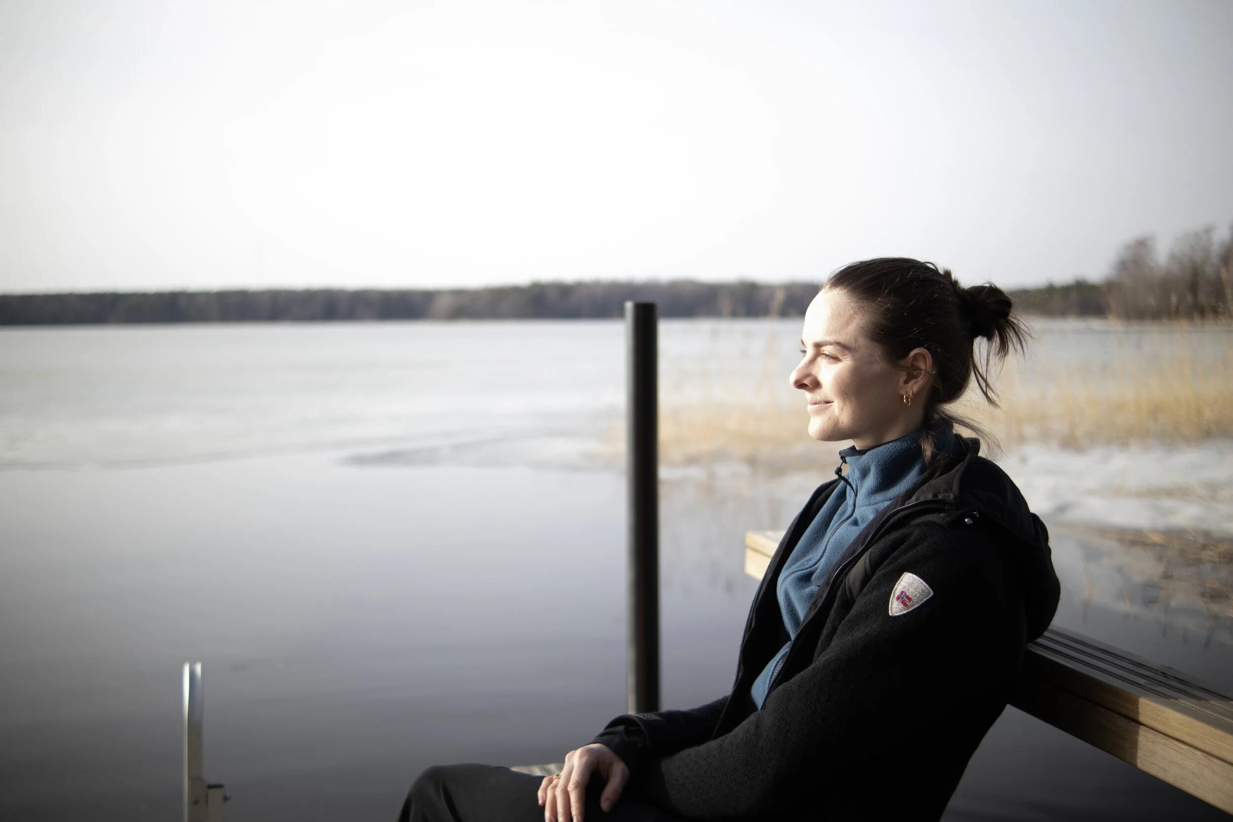 Zael sitting quietly by a lake